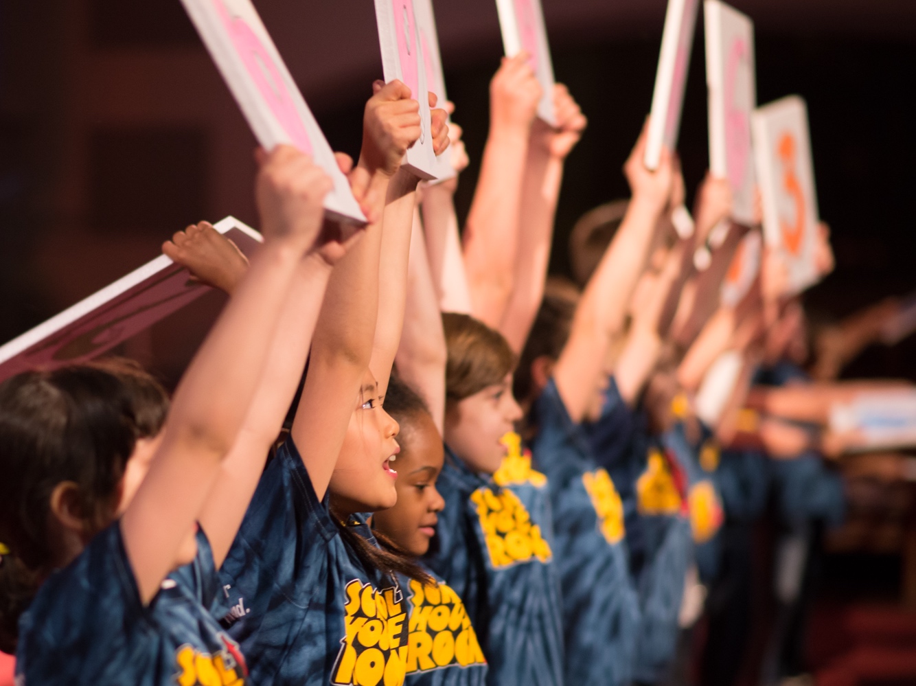 TbT students performing in a line